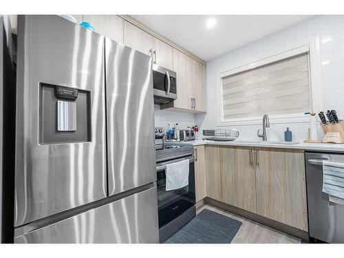 5815 24 Avenue Ne, Calgary, AB - Indoor Photo Showing Kitchen With Stainless Steel Kitchen