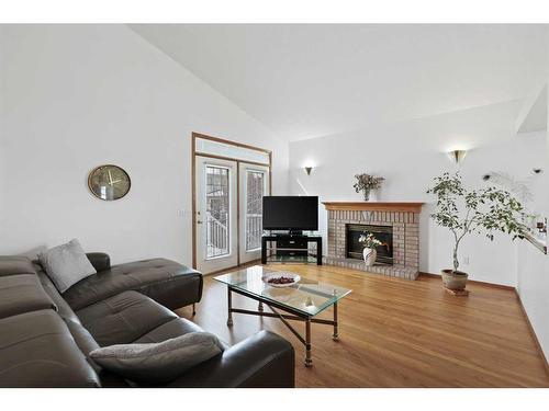 44 Sierra Nevada Rise Sw, Calgary, AB - Indoor Photo Showing Living Room With Fireplace