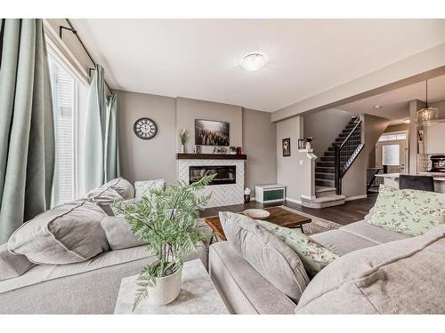 61 Sage Bluff Rise Nw, Calgary, AB - Indoor Photo Showing Living Room With Fireplace