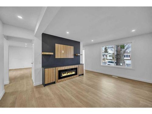 5915 Rundlehorn Drive Ne, Calgary, AB - Indoor Photo Showing Living Room With Fireplace