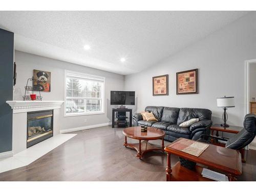 22 Mt Douglas Villas Se, Calgary, AB - Indoor Photo Showing Living Room With Fireplace