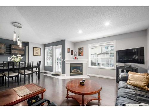 22 Mt Douglas Villas Se, Calgary, AB - Indoor Photo Showing Living Room With Fireplace