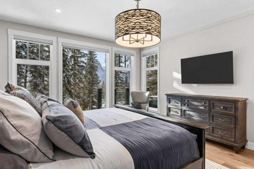 137 Silvertip Ridge, Canmore, AB - Indoor Photo Showing Bedroom