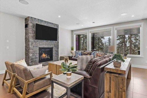 137 Silvertip Ridge, Canmore, AB - Indoor Photo Showing Living Room With Fireplace