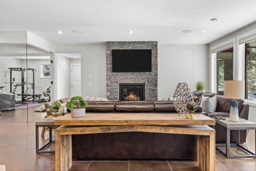 137 Silvertip Ridge, Canmore, AB - Indoor Photo Showing Living Room With Fireplace