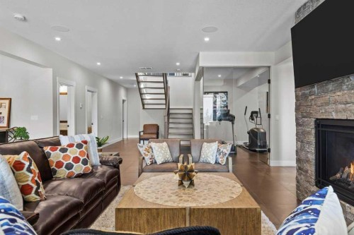 137 Silvertip Ridge, Canmore, AB - Indoor Photo Showing Living Room With Fireplace