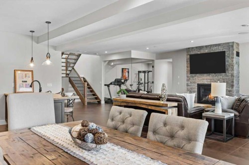 137 Silvertip Ridge, Canmore, AB - Indoor Photo Showing Living Room With Fireplace