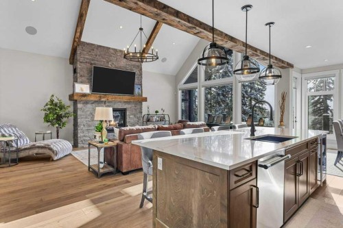 137 Silvertip Ridge, Canmore, AB - Indoor Photo Showing Kitchen With Fireplace With Upgraded Kitchen