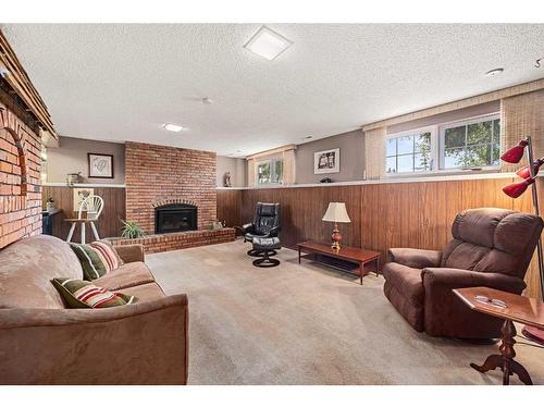 560 Willacy Drive Se, Calgary, AB - Indoor Photo Showing Other Room With Fireplace