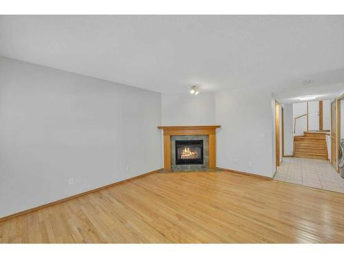 115 Harvest Oak Crescent Ne, Calgary, AB - Indoor Photo Showing Living Room With Fireplace