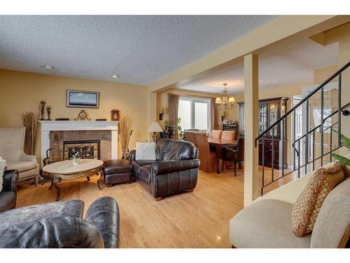 440 Strathcona Mews Sw, Calgary, AB - Indoor Photo Showing Living Room With Fireplace