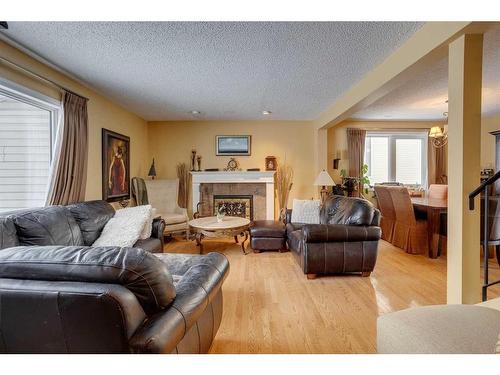 440 Strathcona Mews Sw, Calgary, AB - Indoor Photo Showing Living Room With Fireplace