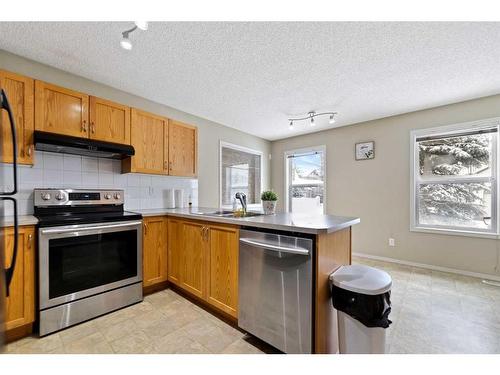 30 Panatella Street Nw, Calgary, AB - Indoor Photo Showing Kitchen