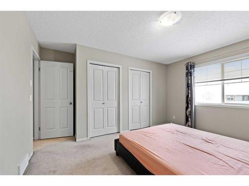 30 Panatella Street Nw, Calgary, AB - Indoor Photo Showing Bedroom