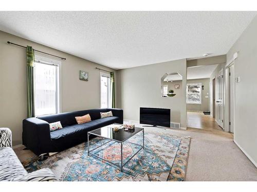 30 Panatella Street Nw, Calgary, AB - Indoor Photo Showing Living Room