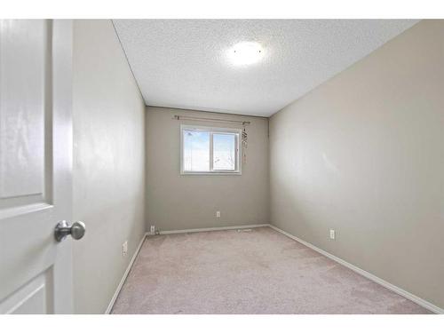 30 Panatella Street Nw, Calgary, AB - Indoor Photo Showing Bedroom