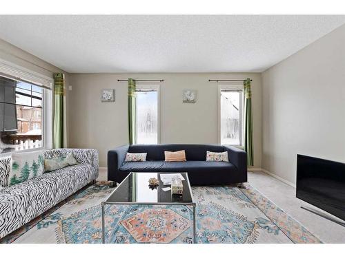 30 Panatella Street Nw, Calgary, AB - Indoor Photo Showing Living Room