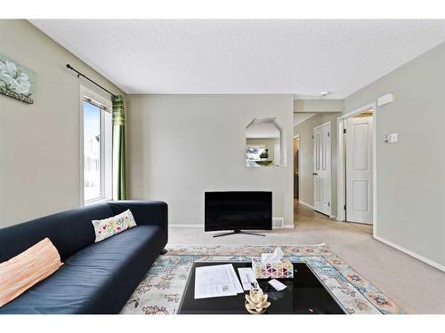 30 Panatella Street Nw, Calgary, AB - Indoor Photo Showing Living Room