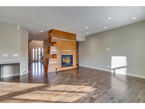 15 Aspen Stone Way Sw, Calgary, AB - Indoor With Fireplace