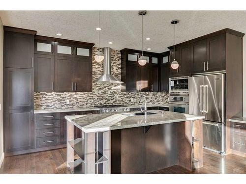 15 Aspen Stone Way Sw, Calgary, AB - Indoor Photo Showing Kitchen With Stainless Steel Kitchen With Double Sink With Upgraded Kitchen