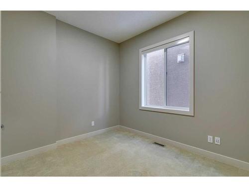 15 Aspen Stone Way Sw, Calgary, AB - Indoor Photo Showing Other Room