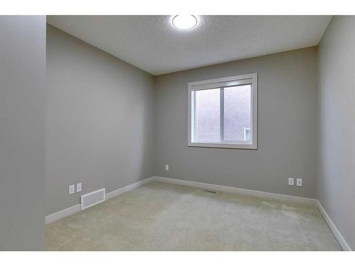 15 Aspen Stone Way Sw, Calgary, AB - Indoor Photo Showing Other Room