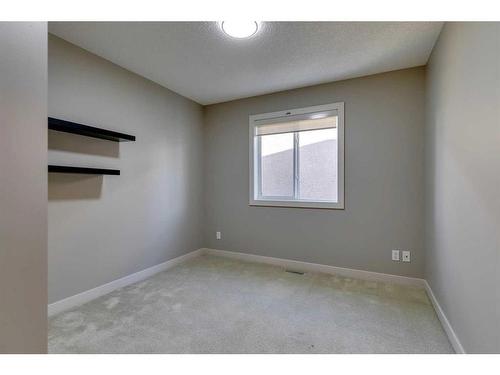 15 Aspen Stone Way Sw, Calgary, AB - Indoor Photo Showing Other Room