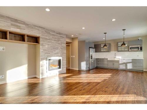 15 Aspen Stone Way Sw, Calgary, AB - Indoor With Fireplace