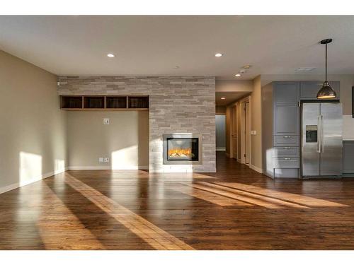 15 Aspen Stone Way Sw, Calgary, AB - Indoor With Fireplace