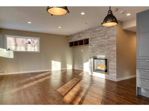 15 Aspen Stone Way Sw, Calgary, AB - Indoor With Fireplace