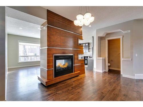 15 Aspen Stone Way Sw, Calgary, AB - Indoor Photo Showing Living Room With Fireplace