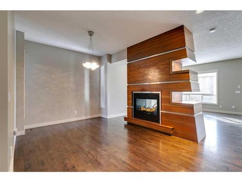 15 Aspen Stone Way Sw, Calgary, AB - Indoor With Fireplace