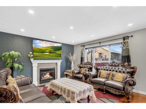 137 Saddlecrest Green Ne, Calgary, AB - Indoor Photo Showing Living Room With Fireplace