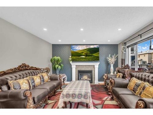 137 Saddlecrest Green Ne, Calgary, AB - Indoor Photo Showing Living Room With Fireplace