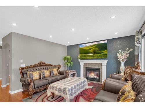 137 Saddlecrest Green Ne, Calgary, AB - Indoor Photo Showing Living Room With Fireplace