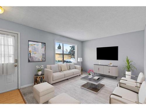 204 Olympia Drive Se, Calgary, AB - Indoor Photo Showing Living Room