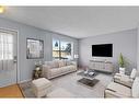 204 Olympia Drive Se, Calgary, AB  - Indoor Photo Showing Living Room 