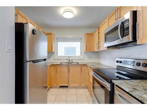 68 Haddock Road Sw, Calgary, AB - Indoor Photo Showing Kitchen With Stainless Steel Kitchen With Double Sink