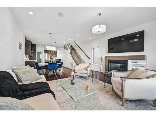 2338 Westmount Road Nw, Calgary, AB - Indoor Photo Showing Living Room With Fireplace