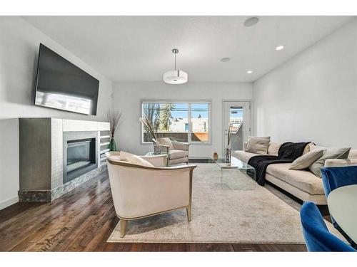 2338 Westmount Road Nw, Calgary, AB - Indoor Photo Showing Living Room With Fireplace