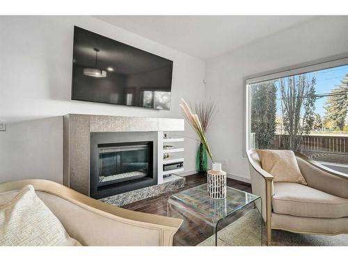 2338 Westmount Road Nw, Calgary, AB - Indoor Photo Showing Living Room With Fireplace