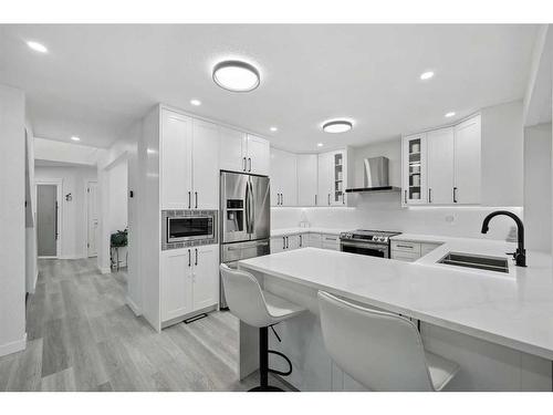 155 Scurfield Place Nw, Calgary, AB - Indoor Photo Showing Kitchen With Double Sink With Upgraded Kitchen