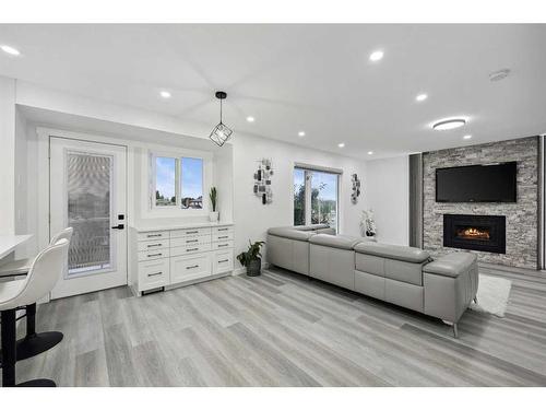 155 Scurfield Place Nw, Calgary, AB - Indoor Photo Showing Living Room With Fireplace