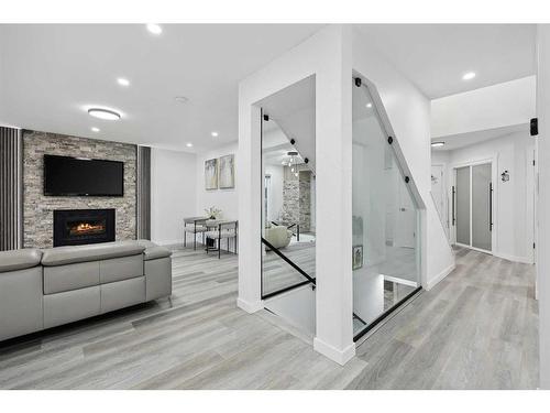 155 Scurfield Place Nw, Calgary, AB - Indoor With Fireplace