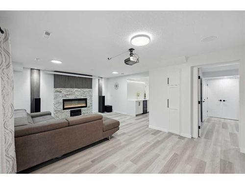 155 Scurfield Place Nw, Calgary, AB - Indoor Photo Showing Living Room With Fireplace