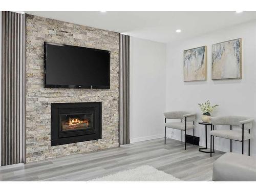 155 Scurfield Place Nw, Calgary, AB - Indoor Photo Showing Living Room With Fireplace