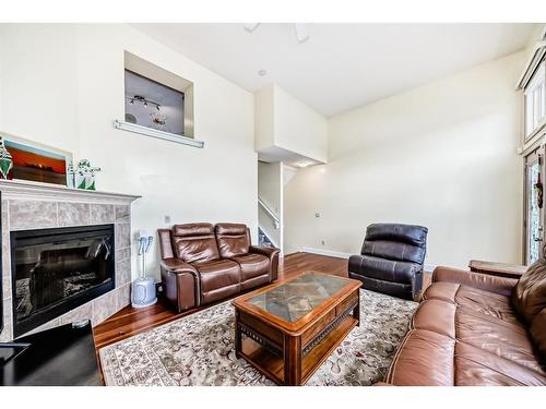 9 Dover Mews Se, Calgary, AB - Indoor Photo Showing Living Room With Fireplace