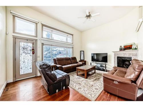 9 Dover Mews Se, Calgary, AB - Indoor Photo Showing Living Room With Fireplace