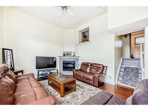 9 Dover Mews Se, Calgary, AB - Indoor Photo Showing Living Room With Fireplace