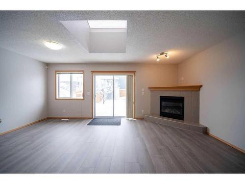 14 Taralea Bay Ne, Calgary, AB - Indoor Photo Showing Living Room With Fireplace